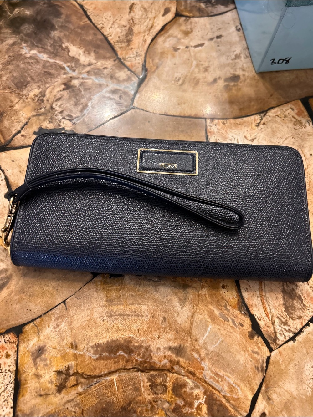 Tumi Textured Leather Wristlet with Gold Plaque